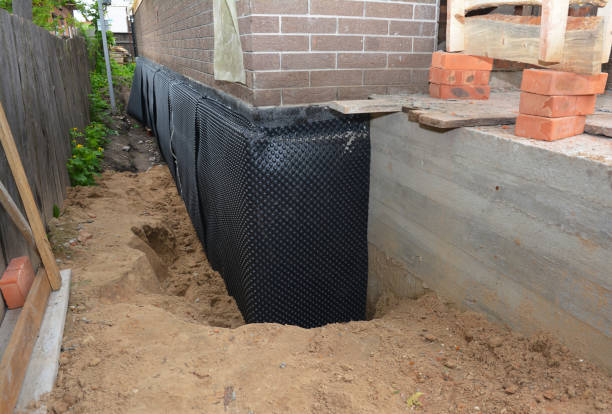 SJ Waterproofing Pros technician performing targeted Waterproofing assessment in Dola, OH